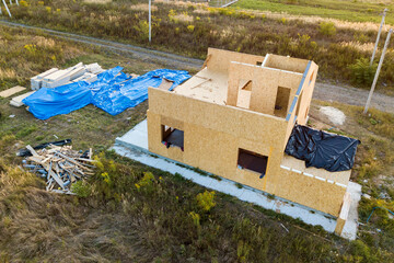 Construction of new and modern modular house. Walls made from composite wooden sip panels with...