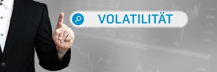 Volatilität. Mann zeigt mit Finger auf Suchfeld im Internet-Browser. Wort/Text (blau) in der Suche.