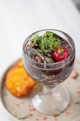 Panther milk, accompanied by black shells and fish.
