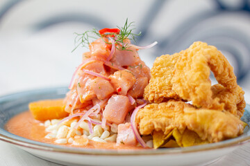 Peruvian eviction, very spicy accompanied by corn, sweet potato and pork rinds with peas.
