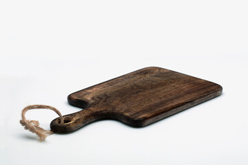 Fototapeta premium Brown wooden cutting board on white background