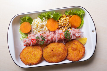 Traditional Peruvian eviction accompanied by fish, corn pancake, sweet potato, canchita and lots of spicy juice.
