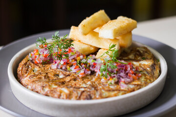 Rayo omelette consists of dried and shredded guitar meat mixed with beaten egg. In addition, ingredients such as Chinese onion and chili pepper are added.
