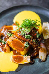 Causa Limeña, accompanied by juicy octopus, corn and sweet potato.
