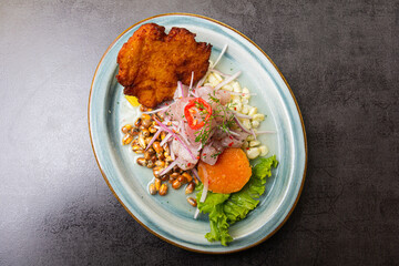 Traditional Peruvian eviction accompanied by fish, corn pancake, sweet potato, canchita and lots of spicy juice.
