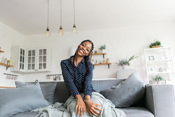 Portrait young black woman smiling happy braids