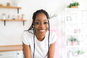 Portrait young black woman smiling happy braids