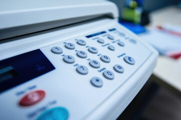 Close-up of fax keyboard button keypad for dialing modern - vintage copy scanner fax machine