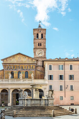 Fototapeta premium Basilica of Santa Maria in Trastevere with blue sky and fountain