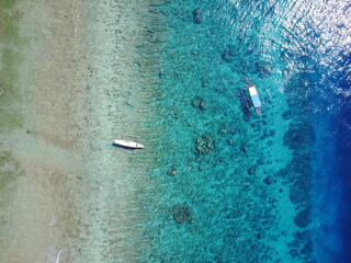 water drops on the window drone view island boat nature explore summer adventure lifestyle Bali Indonesia island Gili T corals blues shades