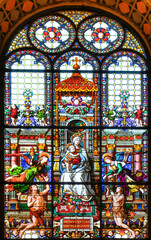 Madonna with child and angels. Cathedral stained glass window - Church in Rome