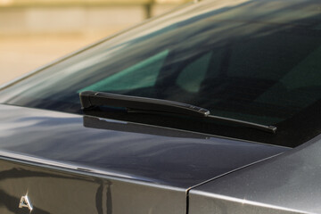 Close up of a modern car wiper. Modern car rear wiper.