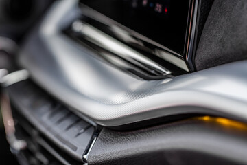 Modern car interior close up view with metallic and plastic details. Interior detail.