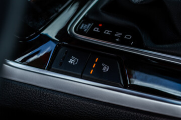 Fototapeta na wymiar Seat heating controller buttons close up view. Car interior. Seat heater button, car interior.