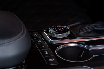 Drive selector button. Car interior, offroad drive controller closeup view. Wheel drive selection....