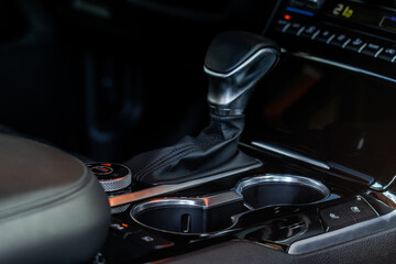 Obraz na płótnie Canvas Cup holders inside modern car interior. Interior view of modern car.