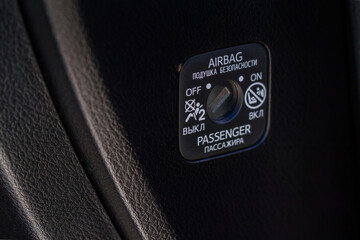 Front passenger airbag on and off switch close up view. Passenger airbag lock. SRS key control system. Airbag deactivation lock close up.