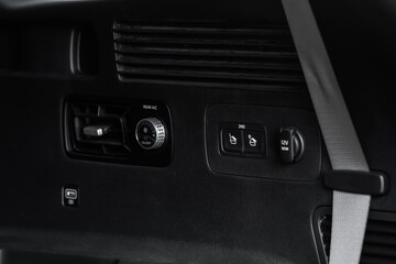 Сontrol panel car air conditioner dashboard. Modern car interior conditioning buttons inside a car close up view.