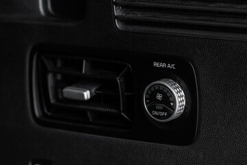 Fototapeta premium Сontrol panel car air conditioner dashboard. Modern car interior conditioning buttons inside a car close up view.