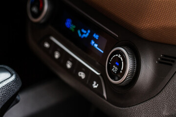 Digital control panel car air conditioner dashboard. Modern car interior conditioning buttons inside a car close up view.