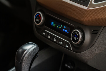 Digital control panel car air conditioner dashboard. Modern car interior conditioning buttons inside a car close up view.