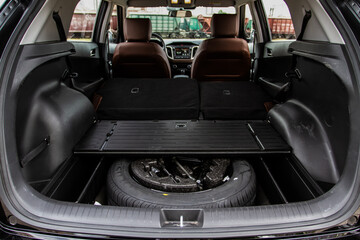 Huge, clean and empty car trunk in interior of compact suv. Rear view of a SUV car with open trunk © Roman
