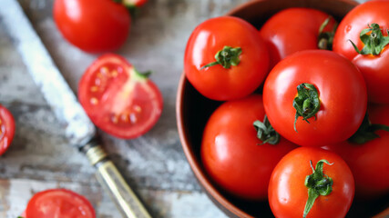 Fresh juicy tomatoes in a bowl.