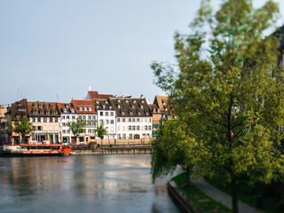Fototapeta na wymiar Tilt-shift view of Main street in Strasbourg with timbered houses and Ill river