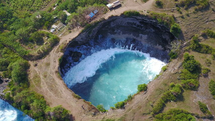 Big hole exotic destination tropical travel vacation nature ocean waves shades of blue paradise Bali preservation nature vegetation forest cliff sea travel Indonesia summer - obrazy, fototapety, plakaty
