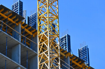 Crane and highrise construction site