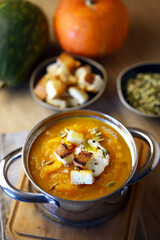 Autumn pumpkin soup in a saucepan.
