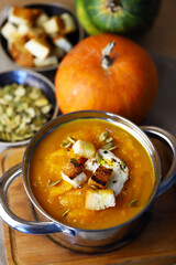 Autumn pumpkin soup in a saucepan.