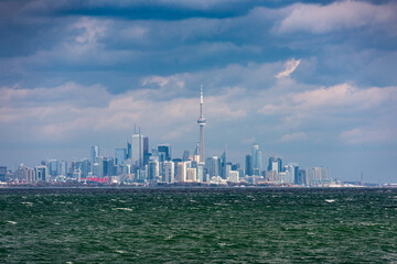 Toronto downtown city line, view from Lake Ontario on stormy weather with cloudy sky, no logos