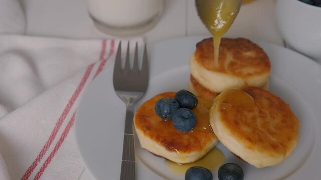 Cheesecakes mlm cottage cheese served with blueberries and honey