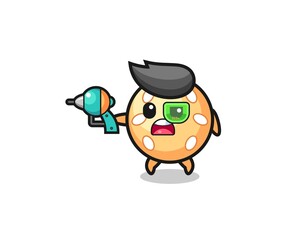 Fototapeta premium cute sesame ball holding a future gun