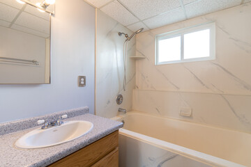 a sink and a bathtub of a home.
