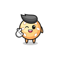 sesame ball character doing Korean finger heart