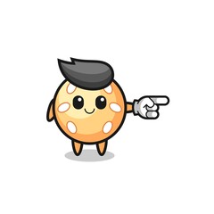 sesame ball mascot with pointing right gesture