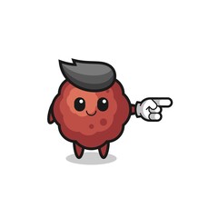 meatball mascot with pointing right gesture