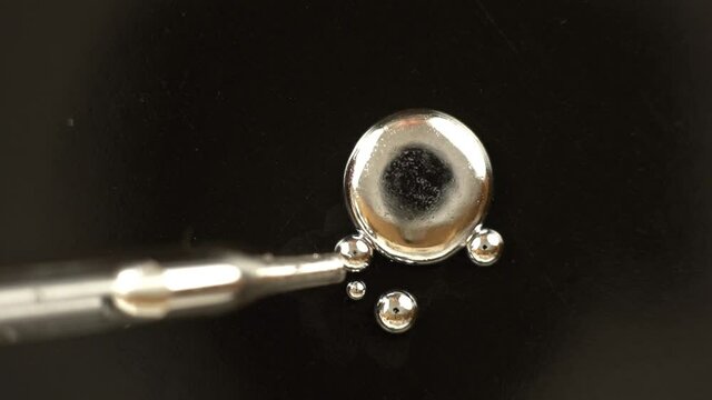 Combining drops of the liquid metal Mercury with an eyedropper