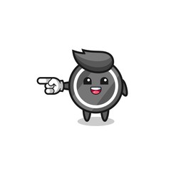 hockey puck cartoon with pointing left gesture