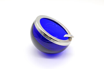 Blue vintage glass and metal ashtray, isolated on a white background