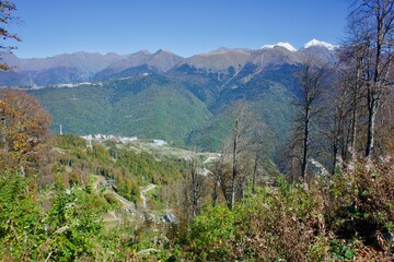 View of the sports hotel complex Rosa Plateau on the background of the Caucasus Mountains. Sochi Russia
