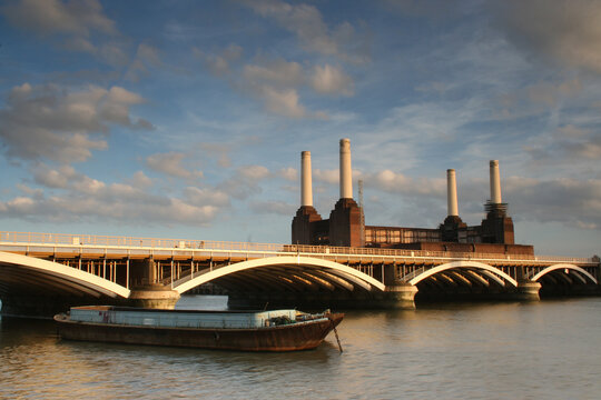River Thames with barge Grosvenor Rail Bridge and Battersea Power Station