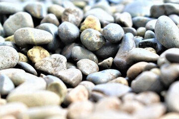 Abstract texture and background gray pebbles at the coastline close-up. High quality photo