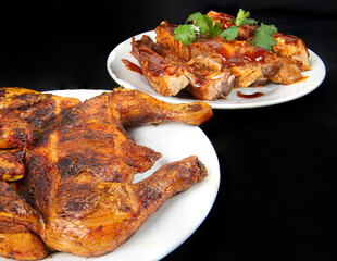Roasted chicken with bbq on a white plate with pieces of cilantro on top, with a black background, a classic Mexican dish 