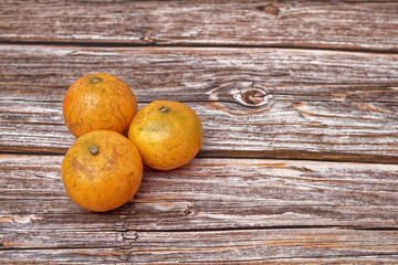 Tangerines isolated on wooden table. 