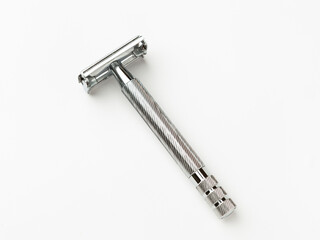 Double-edge safety razor isolated on white background.