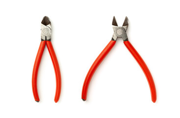 Old wire cutters with red handle isolated on white.