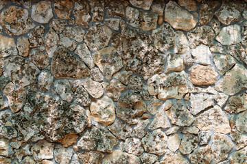 background fragment of a stone wall close-up